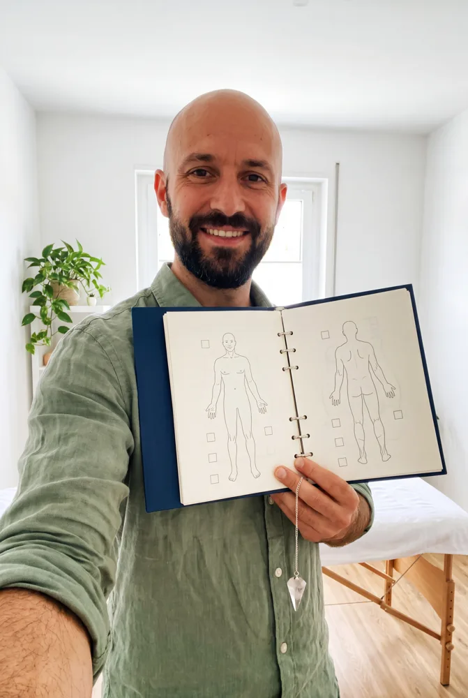 Male practitioner holding the CLEAR binder